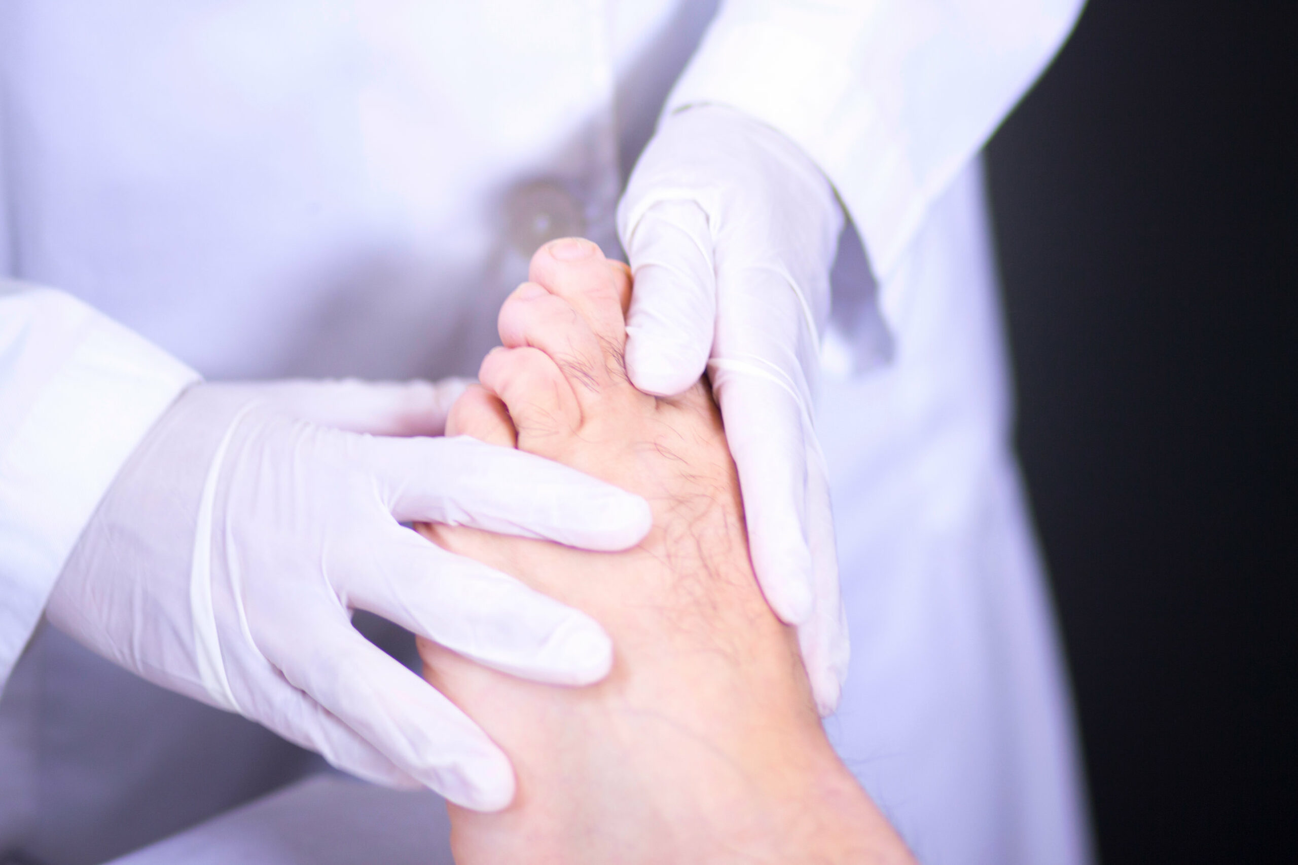 Traumatology and orthopedics surgeon in doctor and patient orthopedic medical examination consultation of foot, ankle and toe